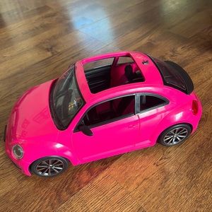 Barbie pink VW beetle car